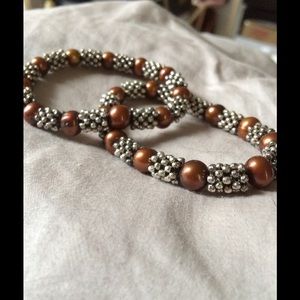 Bronze & silver expandable bracelets.